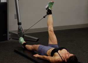 Hip flexion using cable resistance.